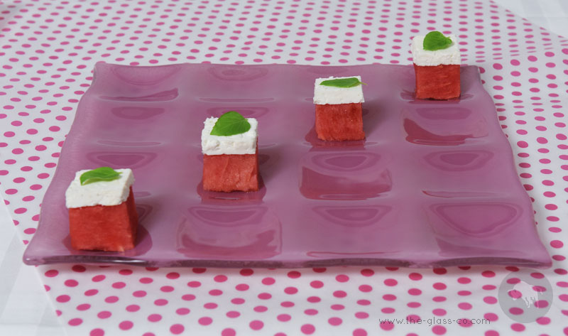 pink square plate with sixteen inlets for fruit presentation for watermelon day